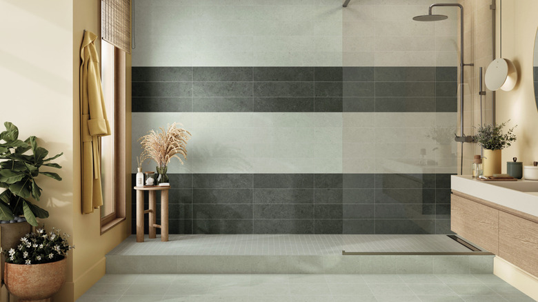 A large walk-in shower done partially in Crossville's Argent 2.0 tile in Silver Sage