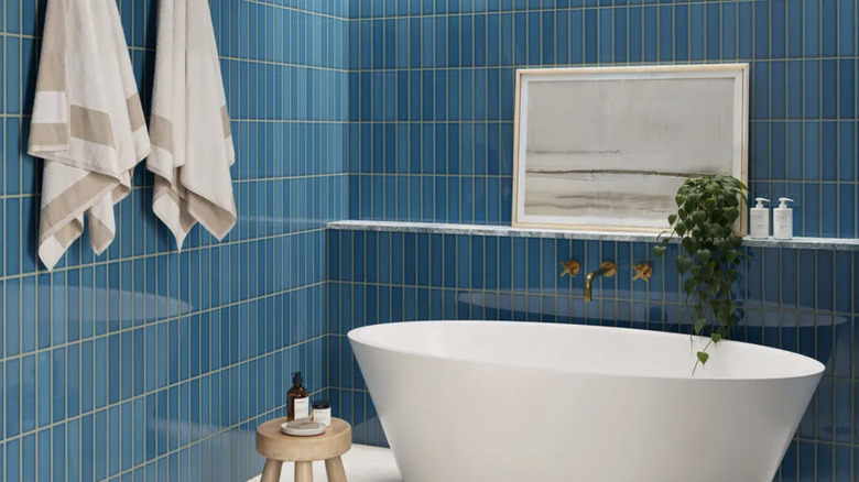 A bathroom with Fireclay Tile's Adriatic Sea Gloss tile on the walls