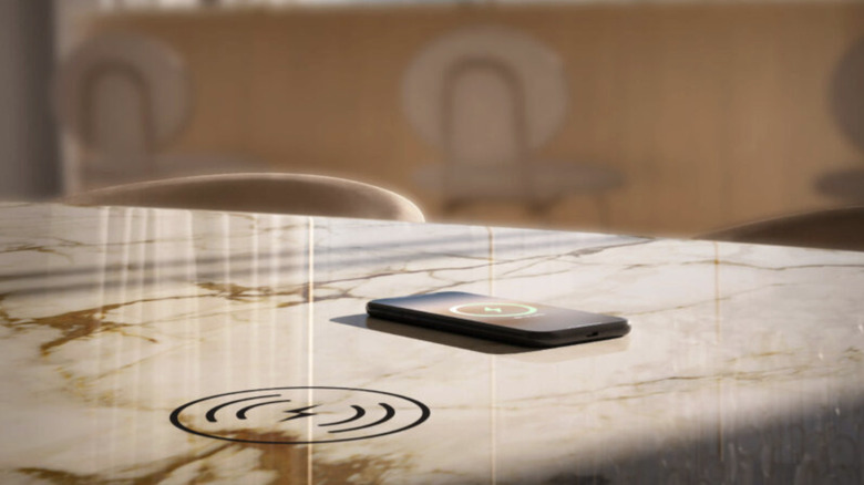 A phone charging on a slab using Stonepeak's Hypertouch technology