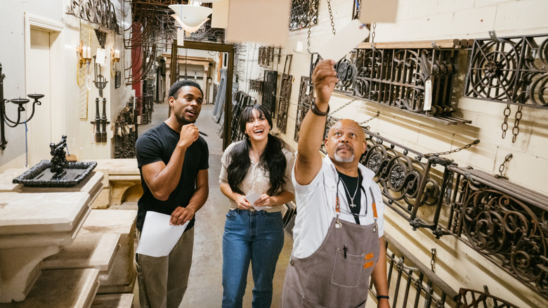Man and woman purchasing lights in shop