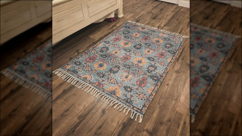 antique-look rug on wood floor
