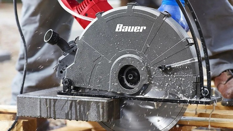 Person using a concrete cutting saw
