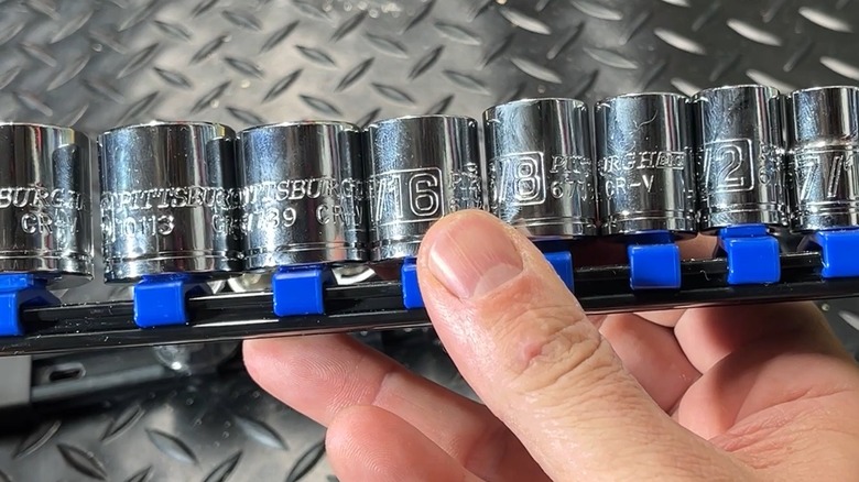Person holding Pittsburgh-branded sockets