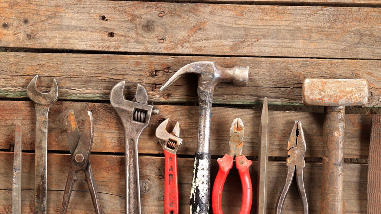 Vintage hand tools on a wooden work bench