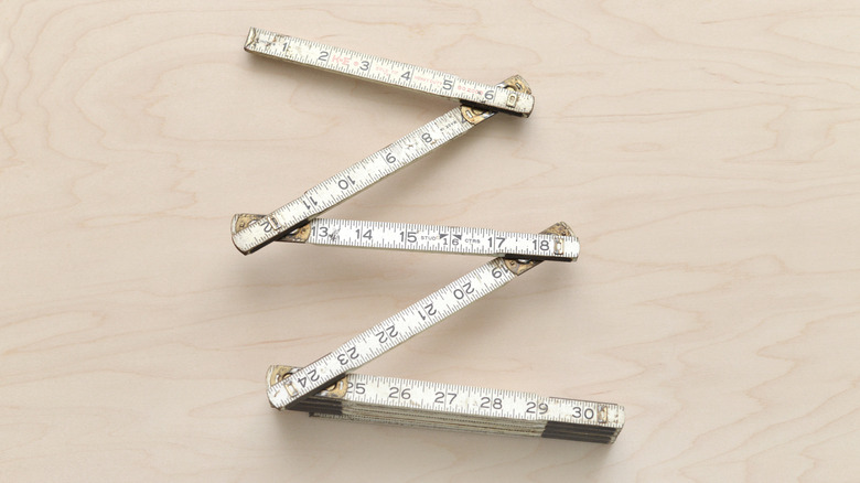 Vintage folding ruler on a wooden table