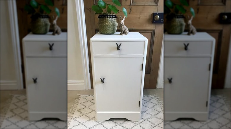 brass rabbit pulls on small cabinet