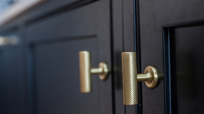 Cylindrical textured knobs on cabinet