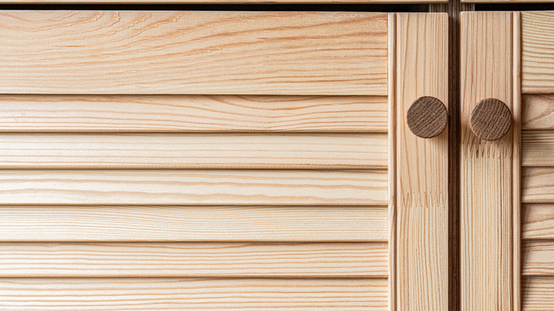 Wood knobs on louvered cabinet doors