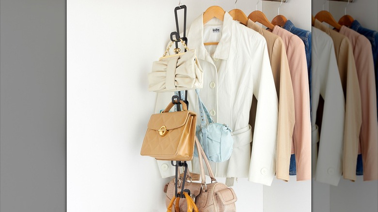 Cascading handbag organizer in closet