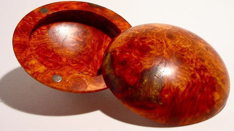 Opened amboyna burl round box