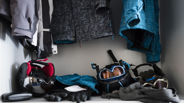 Ski gear at bottom of closet