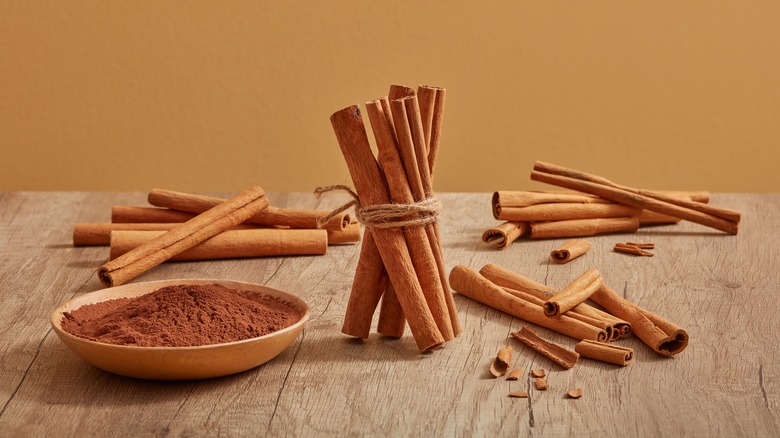 ground cinnamon and cinnamon sticks