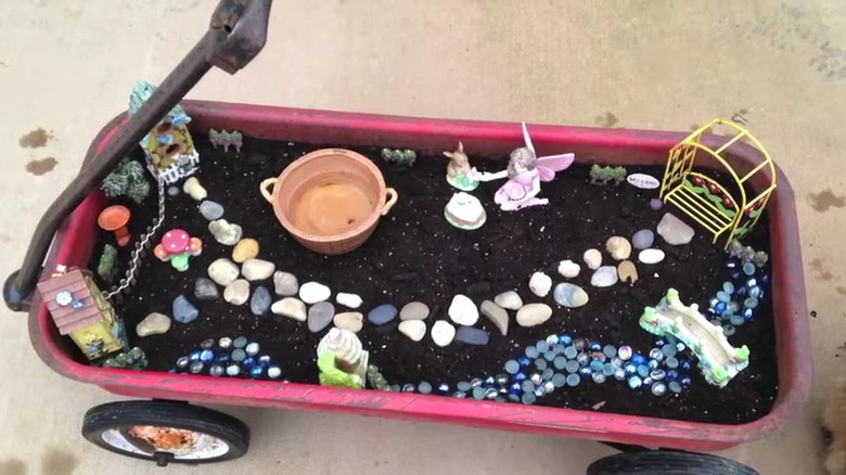 Fairy garden in an old red wagon