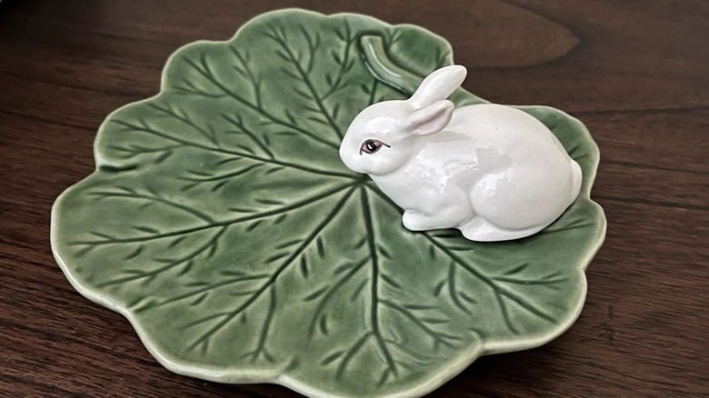 Small plate that looks like a rabbit sitting on a leaf