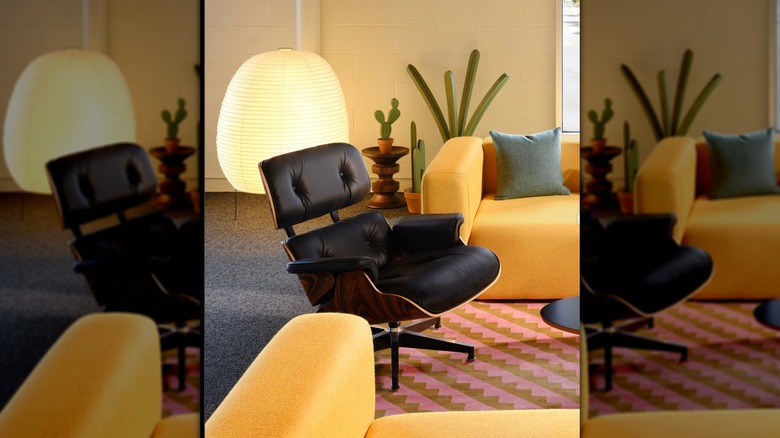 Black Eames chair in colorful room