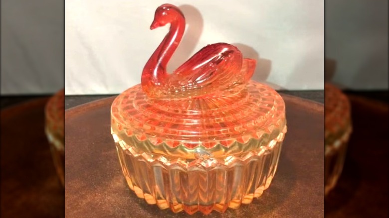 A Jeannette Glass Co. amberina color swan-top powder box