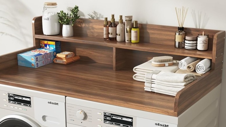 Two-tier washer and dryer countertop in dark walnut.