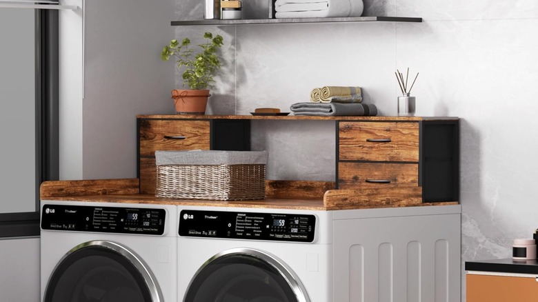 A rustic wood washer and dryer countertop in rustic wood with drawers.