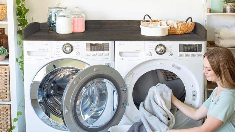 Bamboo washer and dryer countertop with laundry soap on top.