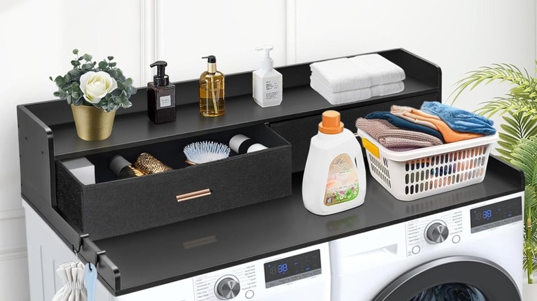 Black washer and dryer countertop with two drawers.