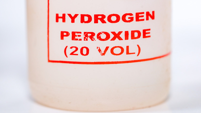 A white bottle of hydrogen peroxide