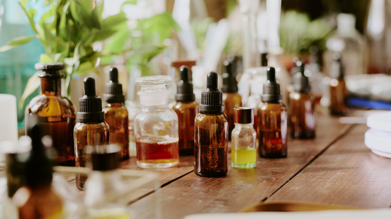 Assorted bottles with droppers containing a variety of essential oils