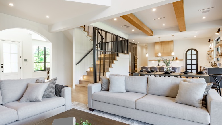 A dining room with ceiling beams.