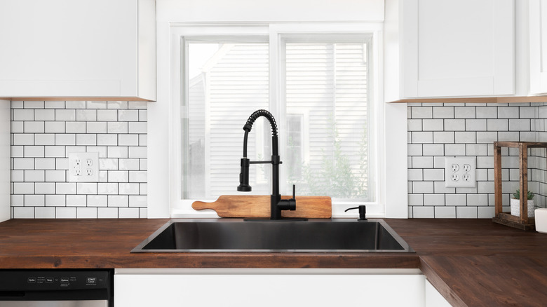 Dark wooden countertop in kitchen