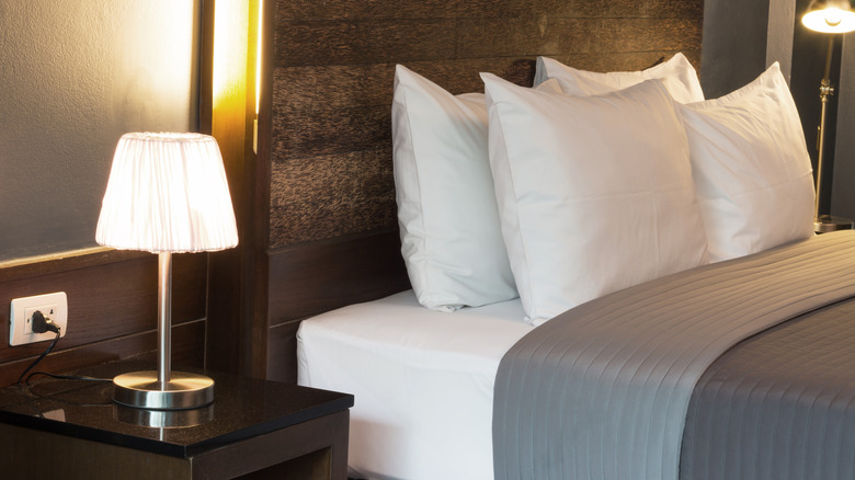 Bed with rustic dark wood headboard