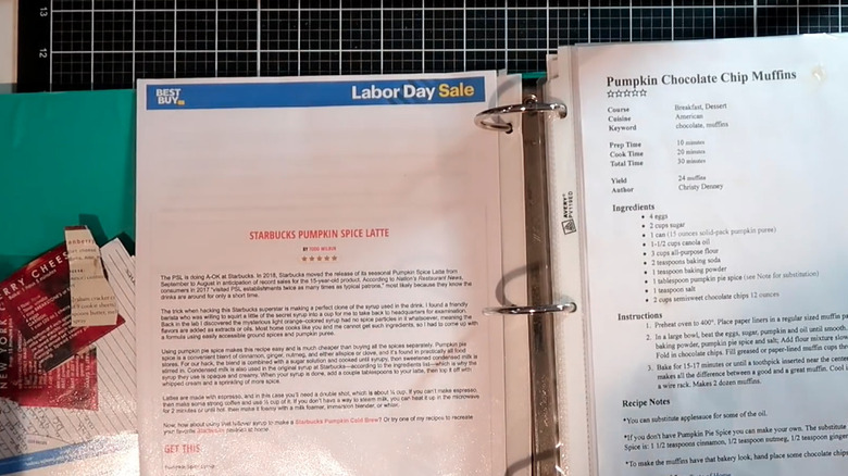 Open binder with plastic sleeves holding printed recipe pages.