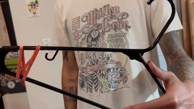 Plastic hanger with thick rubber bands wrapped around the ends.