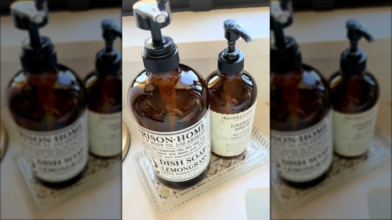 Crystal dish holding soap bottles