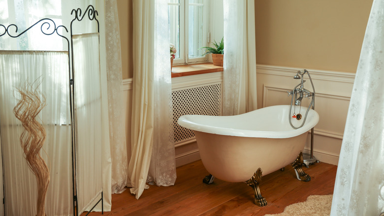 A traditional bathroom with a claw foot tub