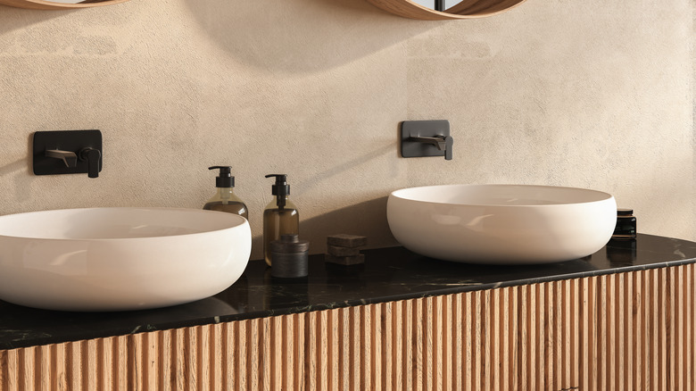 A modern bathroom vanity with fluted wood