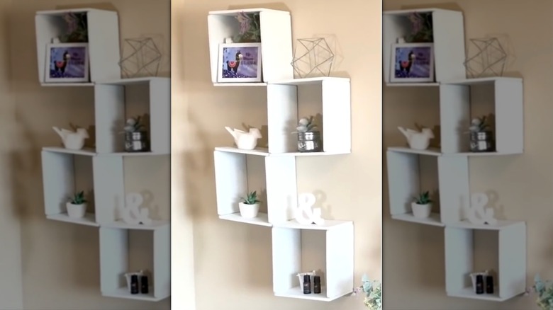 Floating cube shelf made out of Dollar Tree cutting boards glued together.