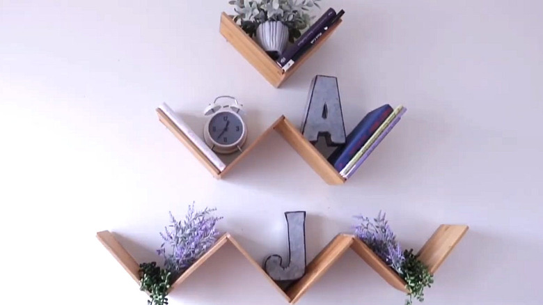 V-shaped floating shelves made out of Dollar Tree cutting boards.