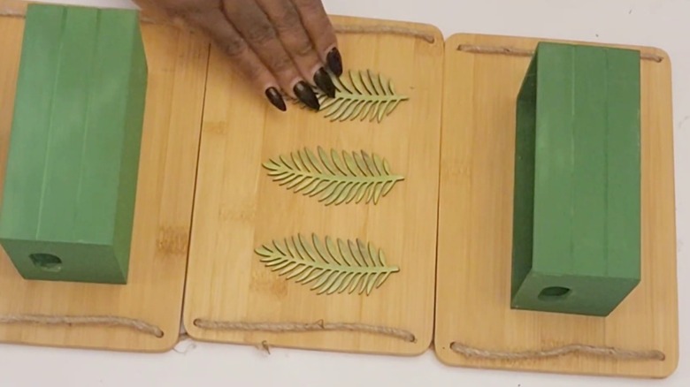 Hanging crate racks made out of Dollar Tree cutting boards and wooden crates.