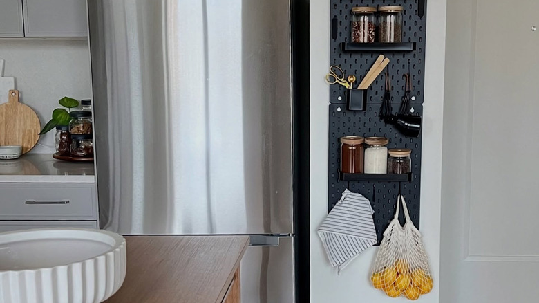 A black IKEA SKÅDIS with kitchen essentials on it