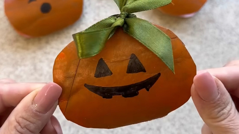 Cute Halloween pumpkin paper ornament with ribbon