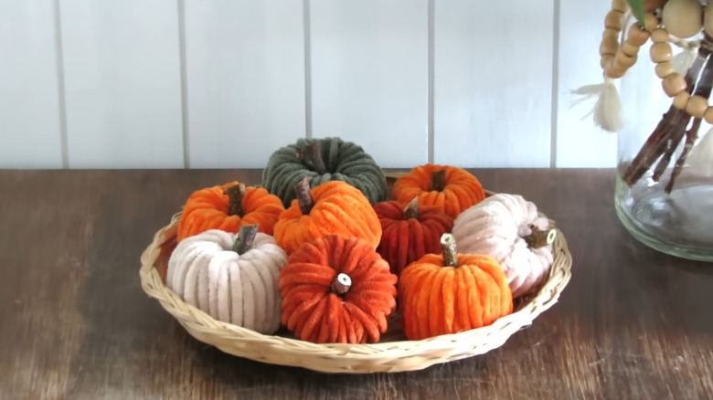 Mini chenille yarn pumpkins with yarn and sticks