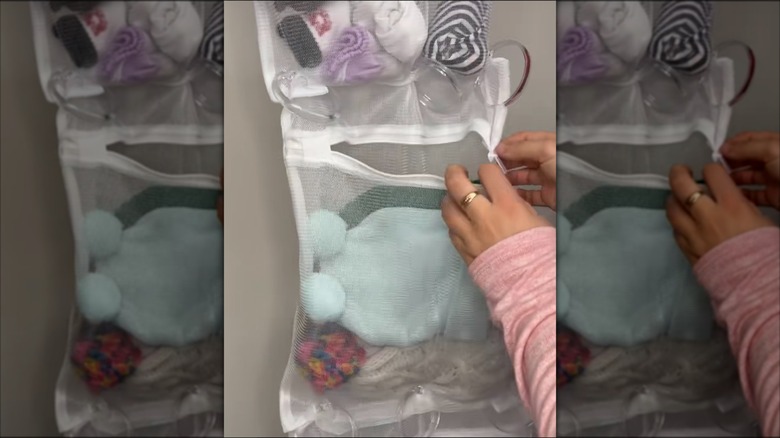 Person zipping a DIY mesh laundry bag storage hanger