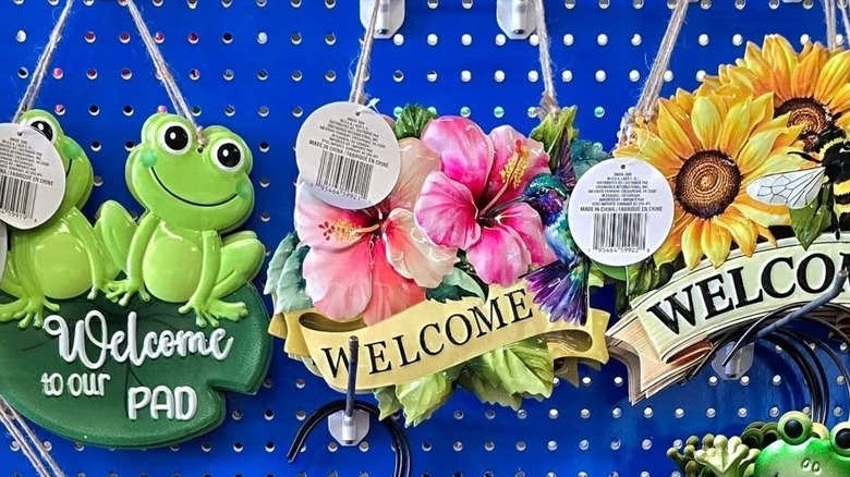 Dollar Tree's Hanging Spring-Themed Floral Welcome Signs in store