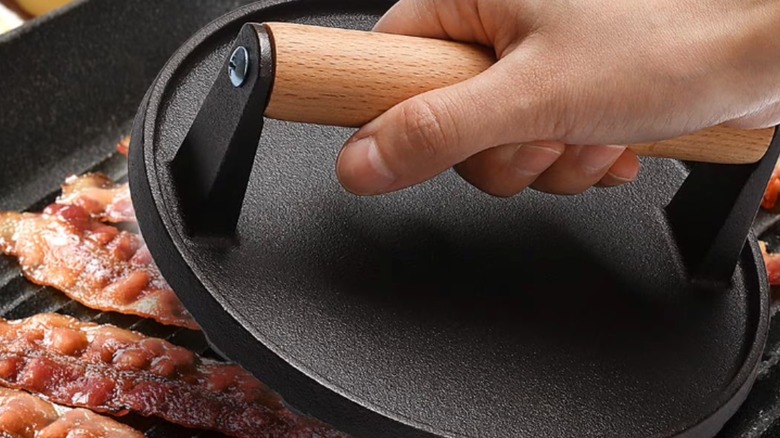 Mibote round burger press being used with a grill