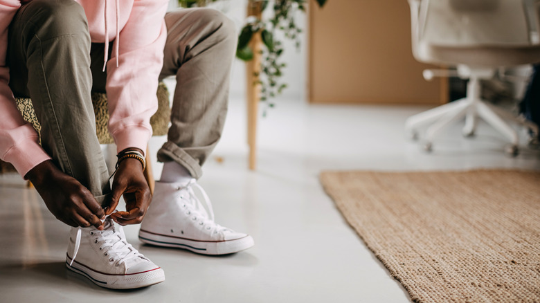Person putting shoes on