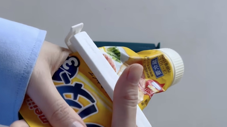 Sealing clips being used as a tube squeezer