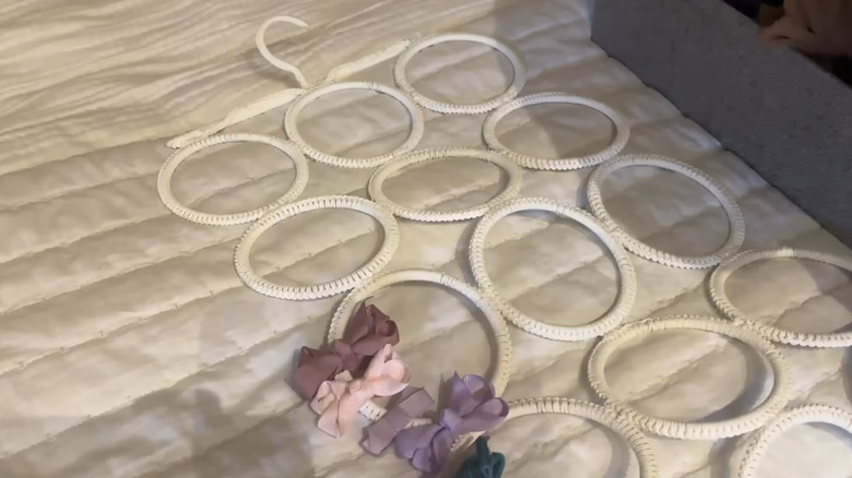 Photo showing a multi-use hanger for hair bow organization