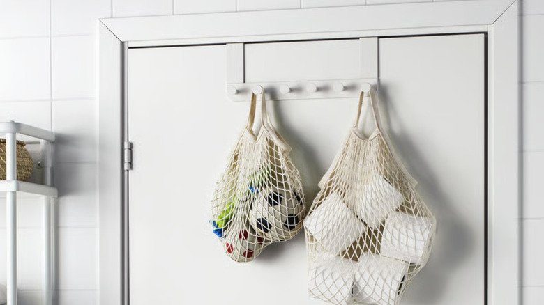IKEA mesh produce bags being used to hold toilet paper and soccer balls