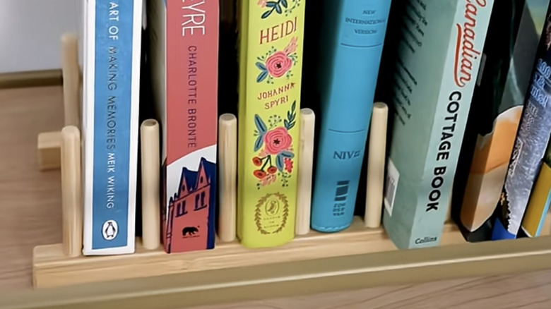 OSTBIT bamboo plate holder serving as a book display