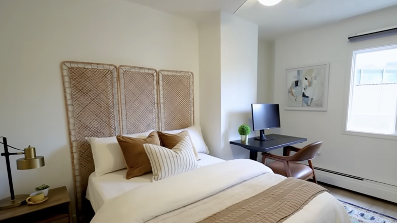 IKEA TOLKNING room divider being used as a headboard