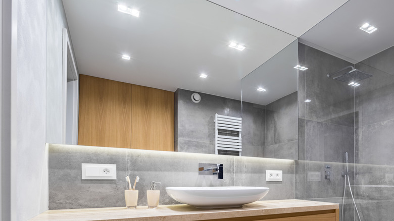 LED ceiling lights reflected in bathroom mirror